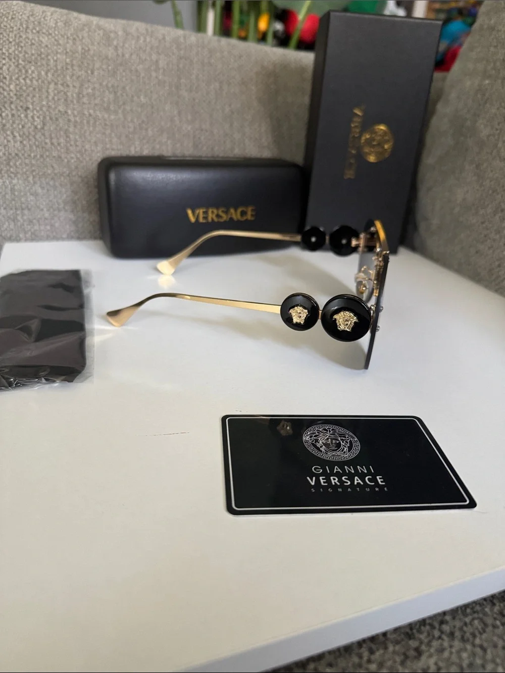 Versace Gold Rimless Sunglasses with Black Lenses